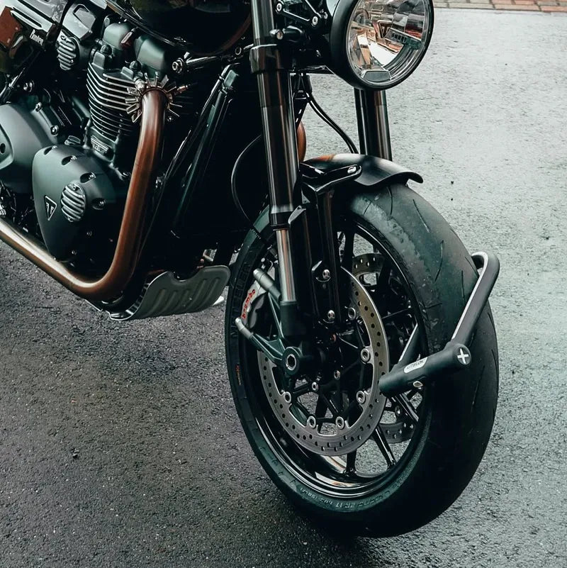 X1 Moto locked over the front wheel and tyre of a Triumph Speed Twin 1200
